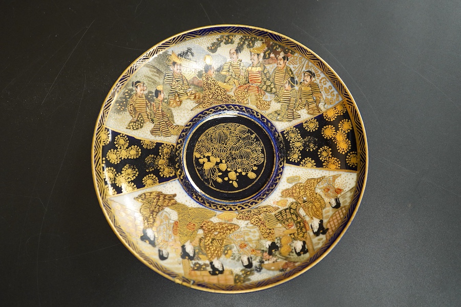A Japanese satsuma pottery cup and saucer, saucer 14cm in diameter